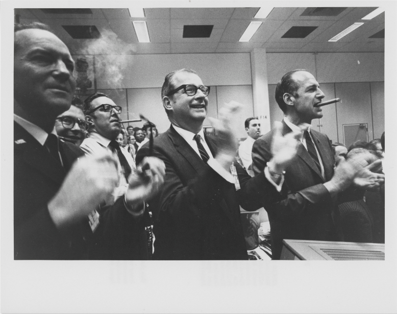 Celebrations in Mission Control after the successful conclusion of the most perilous journey of the entire Apollo program