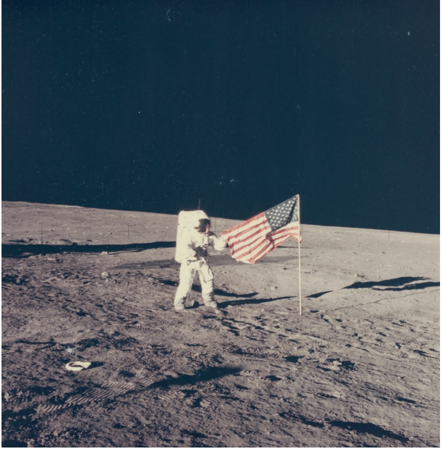 Charles Pete Conrad Standing by the US Flag